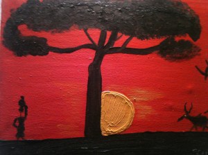 Red Sky as Sun sets behind acacia tree